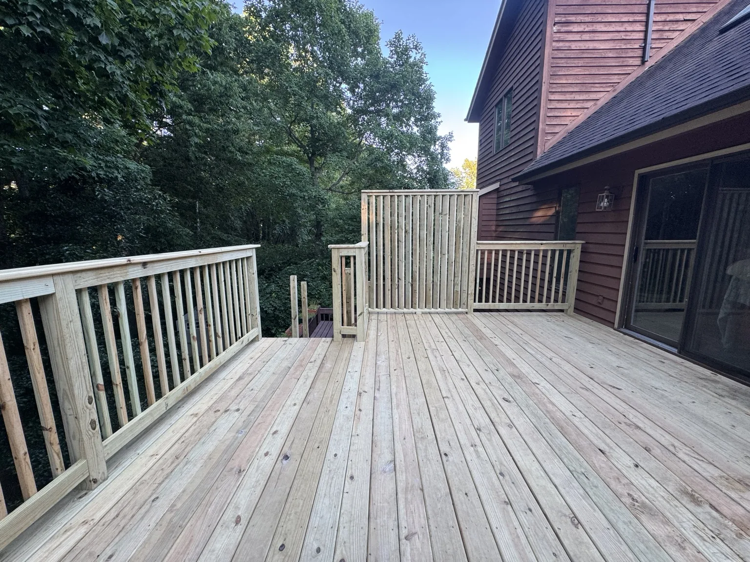 Treated deck with stairs and railing