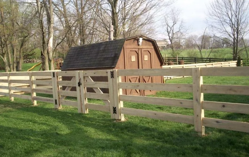 Four-rail fence around a yard