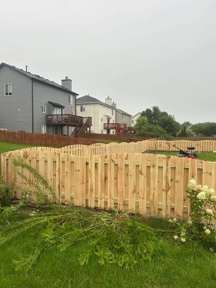 Wood privacy fence around a backyard